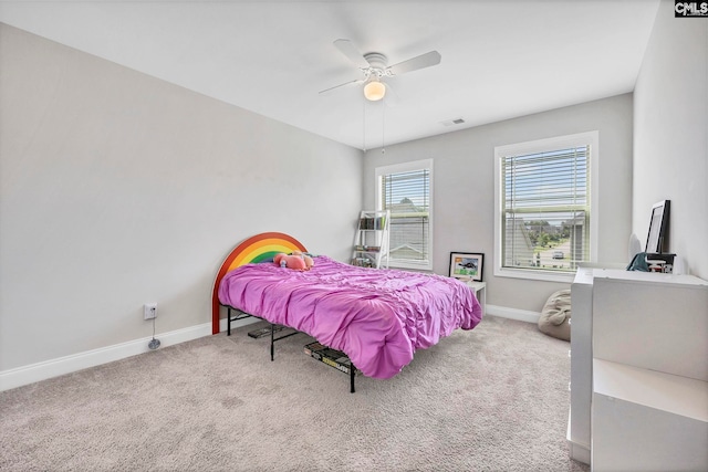 bedroom featuring baseboards, carpet flooring, and ceiling fan