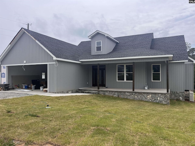 281 Osprey Pointe Ln, Prosperity, SC 29127 - view of front of home with roof with shingles, a front lawn, an attached garage, and covered porch