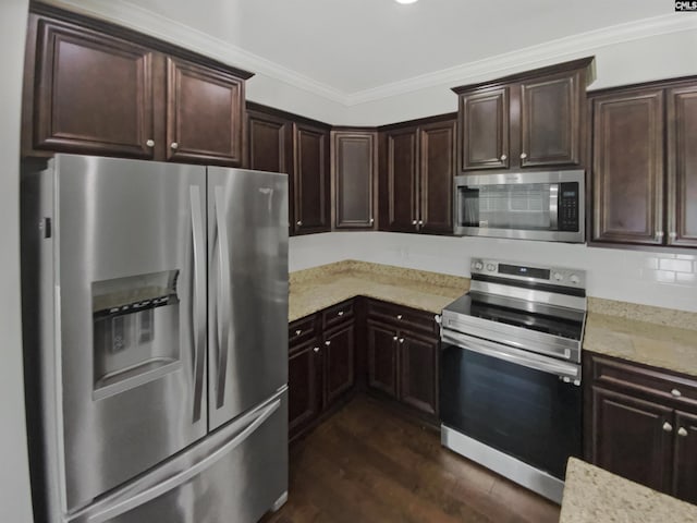 kitchen with stainless steel appliances, ornamental molding, light stone counters, dark wood-style flooring, and dark brown cabinetry