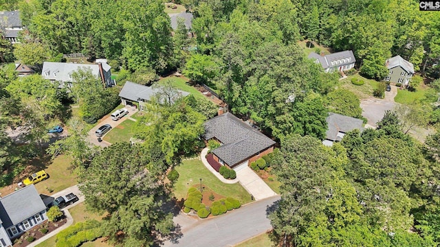 aerial view of property and surrounding area featuring nearby suburban area