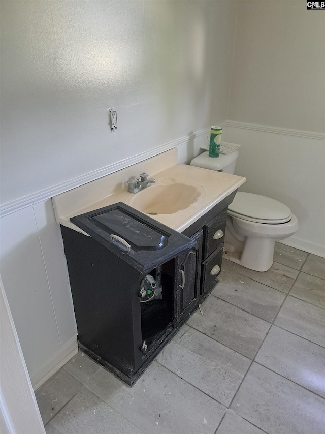 29 Seaboard St, Great Falls, SC 29055 - bathroom with vanity, toilet, a wainscoted wall, and a decorative wall