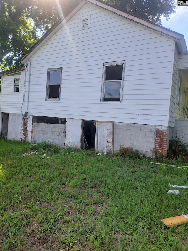 29 Seaboard St, Great Falls, SC 29055 - back of house featuring a lawn