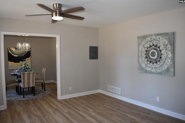 813 Greenlawn Dr, Columbia, SC 29209 - dining space featuring electric panel, wood finished floors, ceiling fan, baseboards, and a chandelier