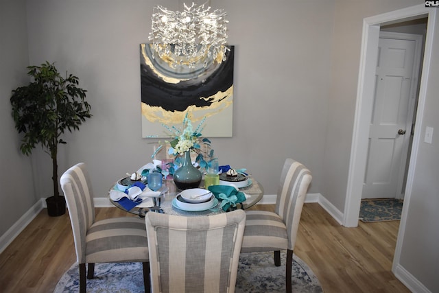 813 Greenlawn Dr, Columbia, SC 29209 - dining area with a chandelier, wood finished floors, and baseboards