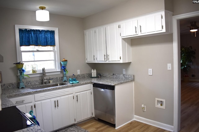 813 Greenlawn Dr, Columbia, SC 29209 - kitchen featuring a sink, stainless steel dishwasher, light wood-type flooring, and white cabinetry