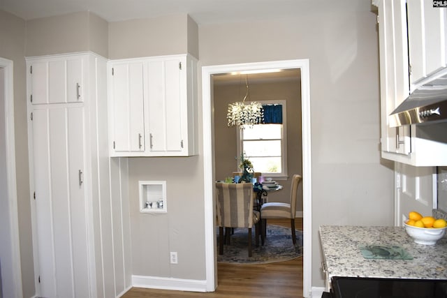 813 Greenlawn Dr, Columbia, SC 29209 - clothes washing area with wood finished floors, a chandelier, and baseboards