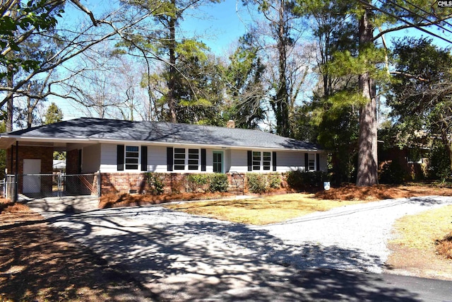 813 Greenlawn Dr, Columbia, SC 29209 - single story home featuring asphalt driveway, brick siding, a carport, a chimney, and fence