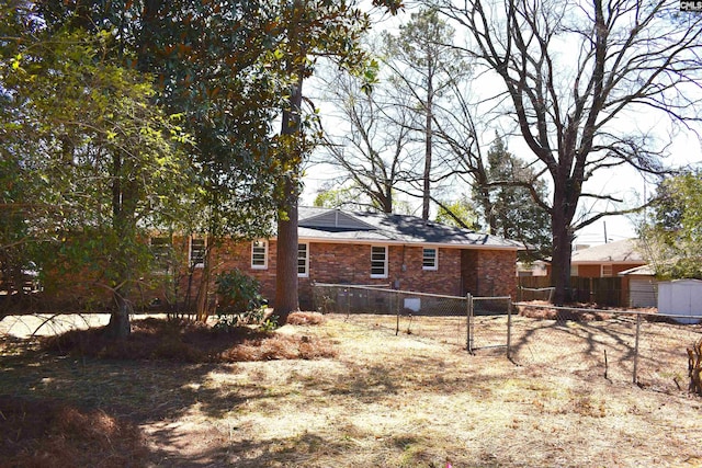 813 Greenlawn Dr, Columbia, SC 29209 - rear view of house featuring fence, a gate, and brick siding