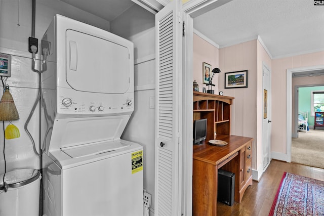 4833 Circle Dr, Columbia, SC 29206 - laundry room featuring stacked washer / drying machine, ornamental molding, wood finished floors, baseboards, and a textured ceiling