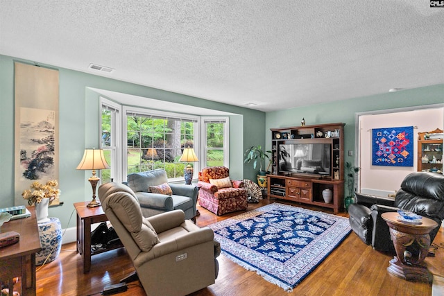 4833 Circle Dr, Columbia, SC 29206 - living room with wood finished floors and a textured ceiling