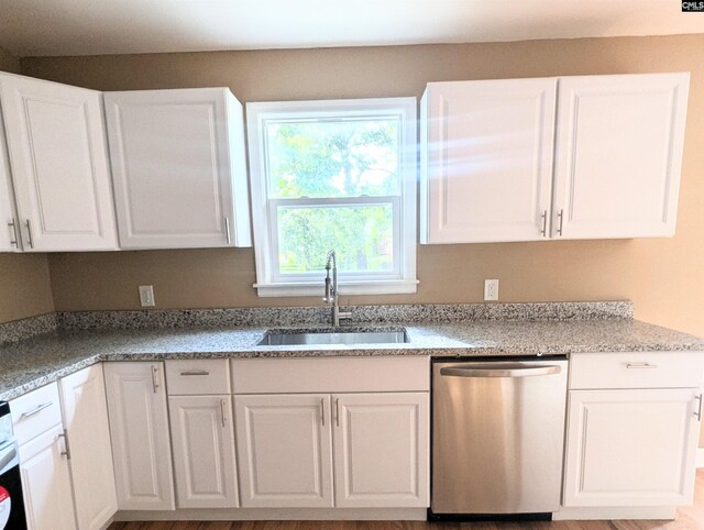 1921 Spotswood Dr, Columbia, SC 29210 - kitchen featuring dishwasher, a sink, and white cabinets