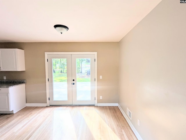 1921 Spotswood Dr, Columbia, SC 29210 - doorway with light wood-style floors, baseboards, and french doors