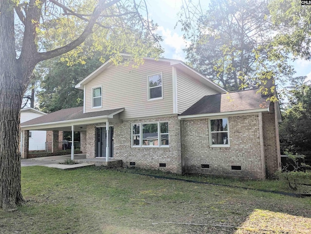 1921 Spotswood Dr, Columbia, SC 29210 - view of front facade featuring crawl space, brick siding, a front lawn, an attached carport, and a shingled roof