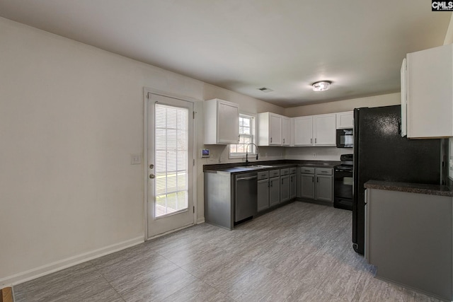 175 Nestle Ct, Columbia, SC 29209 - kitchen featuring black appliances, a sink, dark countertops, and white cabinets