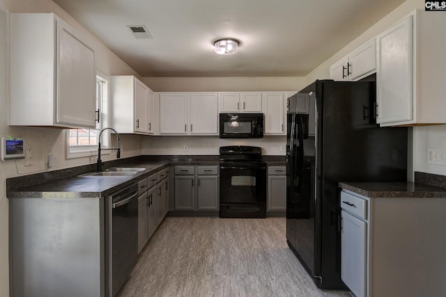 175 Nestle Ct, Columbia, SC 29209 - kitchen with black appliances, a sink, dark countertops, and white cabinets