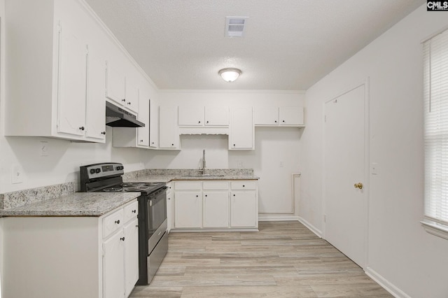 kitchen with stainless steel range with electric stovetop, under cabinet range hood, a sink, white cabinetry, and a textured ceiling
