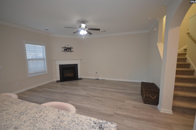 113 Judiths Path, West Columbia, SC 29072 - living area featuring ceiling fan, crown molding, light wood-style flooring, stairway, and a fireplace with flush hearth