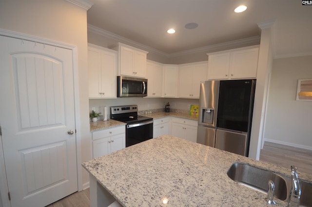 113 Judiths Path, West Columbia, SC 29072 - kitchen featuring appliances with stainless steel finishes, crown molding, a sink, white cabinetry, and light wood finished floors