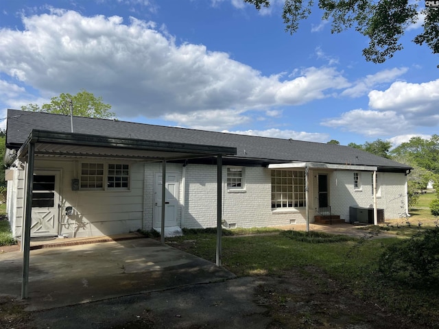 back of property featuring entry steps, brick siding, central air condition unit, crawl space, and a patio