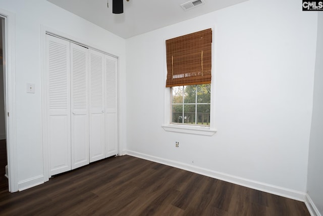 808 Oak St, Columbia, SC 29205 - unfurnished bedroom with dark wood finished floors, baseboards, a closet, and ceiling fan