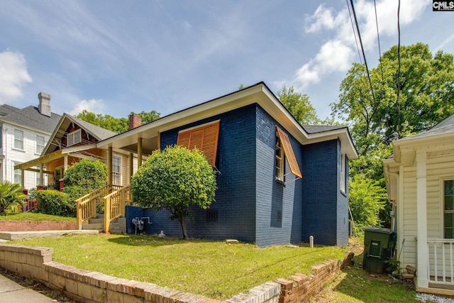 808 Oak St, Columbia, SC 29205 - view of home's exterior featuring brick siding and a lawn