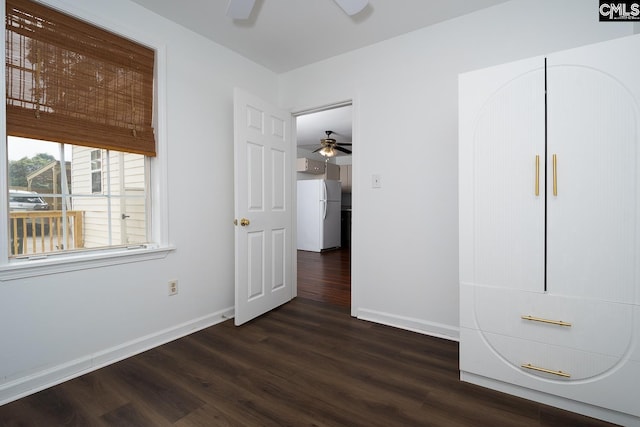 808 Oak St, Columbia, SC 29205 - unfurnished bedroom featuring freestanding refrigerator, dark wood-style floors, baseboards, and a ceiling fan