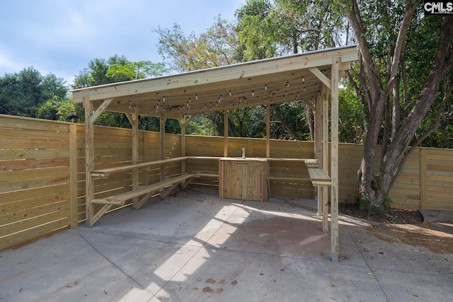 808 Oak St, Columbia, SC 29205 - view of patio featuring an exterior structure, an outbuilding, and a carport