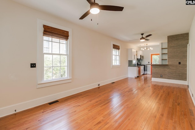 808 Oak St, Columbia, SC 29205 - unfurnished living room with a ceiling fan, baseboards, and light wood-style flooring