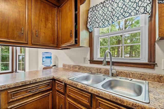 401 Brickling Rd, Irmo, SC 29063 - kitchen featuring a sink, light countertops, and brown cabinets