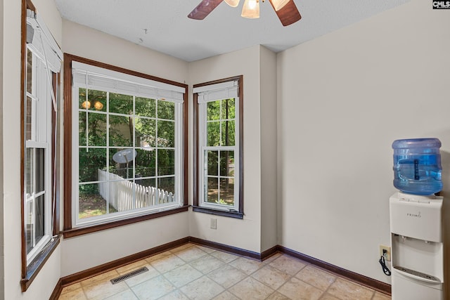 401 Brickling Rd, Irmo, SC 29063 - doorway to outside featuring baseboards, ceiling fan, and a textured ceiling