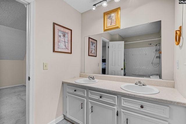 401 Brickling Rd, Irmo, SC 29063 - bathroom featuring double vanity, a shower, and baseboards