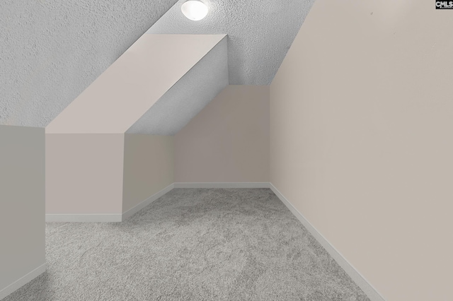 401 Brickling Rd, Irmo, SC 29063 - additional living space with light carpet, lofted ceiling, baseboards, and a textured ceiling