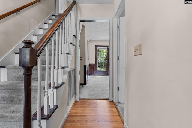 401 Brickling Rd, Irmo, SC 29063 - hall with wood finished floors, baseboards, stairs, and a textured ceiling