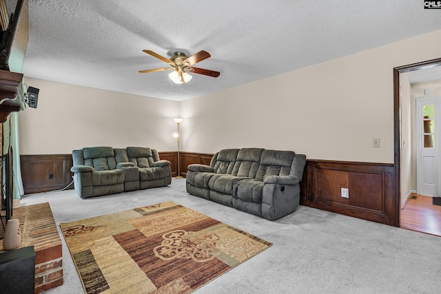 401 Brickling Rd, Irmo, SC 29063 - living room featuring light carpet, a ceiling fan, wainscoting, and a textured ceiling