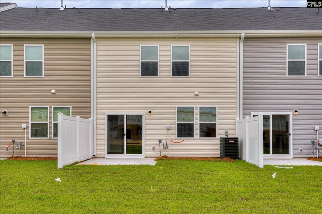 1097 Corneila St, Elgin, SC 29045 - back of property with a lawn and central air condition unit