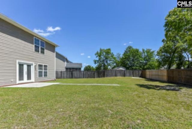 view of yard with a patio area and french doors