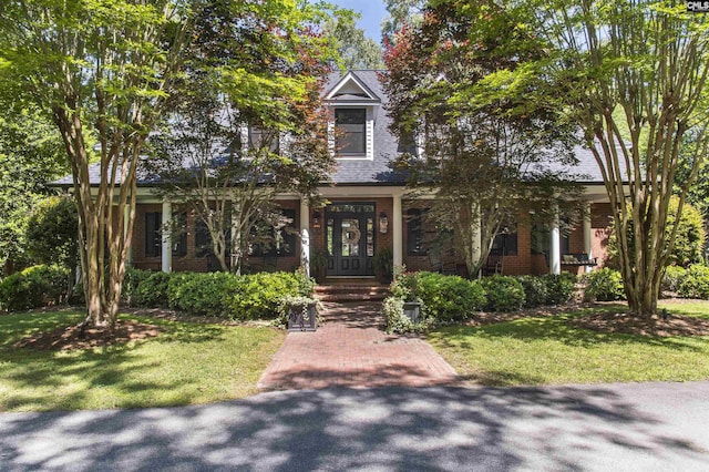 3 Puddle Ln, Camden, SC 29020 - view of property hidden behind natural elements with brick siding and a front yard