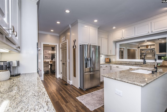 3 Puddle Ln, Camden, SC 29020 - kitchen featuring stainless steel refrigerator with ice dispenser, a sink, ornamental molding, white cabinets, and light stone counters