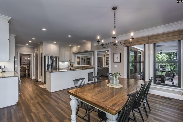 3 Puddle Ln, Camden, SC 29020 - dining area with crown molding, dark wood finished floors, a chandelier, recessed lighting, and baseboards
