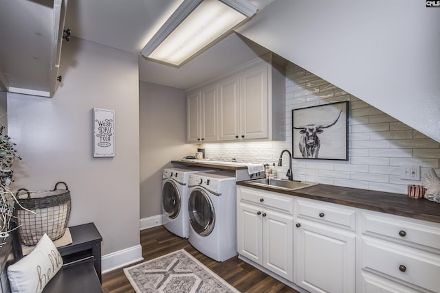 3 Puddle Ln, Camden, SC 29020 - laundry room featuring cabinet space, washing machine and dryer, dark wood-type flooring, and baseboards