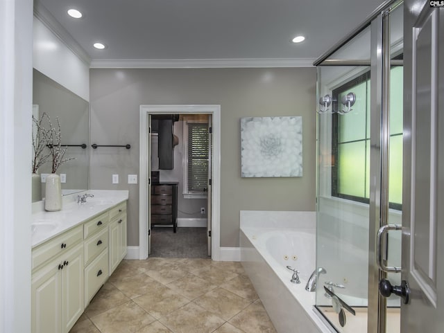 3 Puddle Ln, Camden, SC 29020 - bathroom with ornamental molding, a tub with jets, baseboards, double vanity, and tile patterned floors