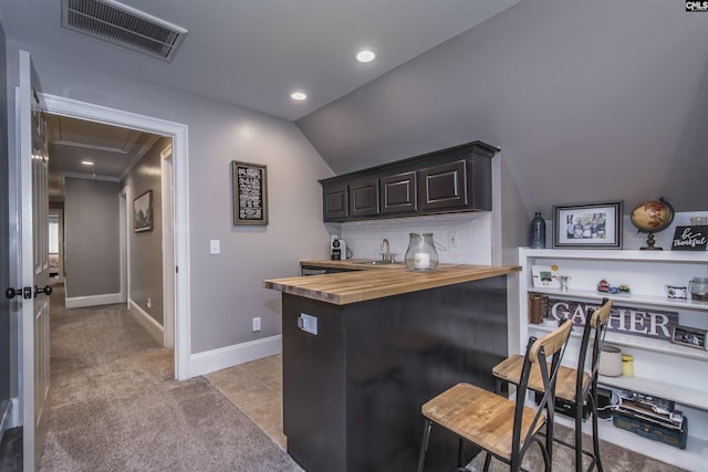 3 Puddle Ln, Camden, SC 29020 - indoor wet bar with vaulted ceiling, recessed lighting, decorative backsplash, light carpet, and baseboards