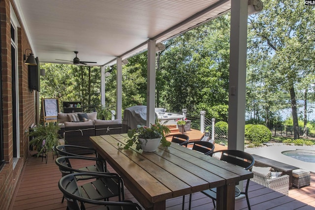 3 Puddle Ln, Camden, SC 29020 - wooden terrace with outdoor dining space, a ceiling fan, outdoor lounge area, grilling area, and view of wooded area