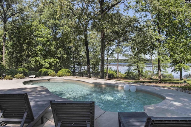 3 Puddle Ln, Camden, SC 29020 - swimming pool with a patio, a water view, and fence