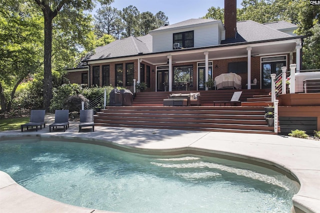 3 Puddle Ln, Camden, SC 29020 - back of property with stairs, a patio, brick siding, and an outdoor pool