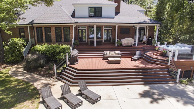 3 Puddle Ln, Camden, SC 29020 - back of house featuring brick siding, a wooden deck, and an outdoor hangout area