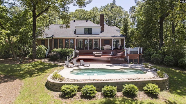 3 Puddle Ln, Camden, SC 29020 - back of property featuring a deck, a jacuzzi, a chimney, and a lawn