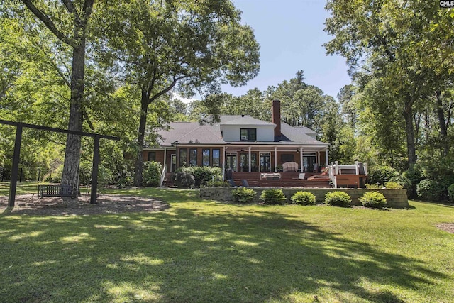 3 Puddle Ln, Camden, SC 29020 - rear view of property featuring a yard, a sunroom, and a chimney
