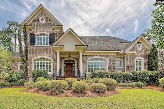 104 Preserve Ln, Columbia, SC 29209 - colonial house with brick siding, a front yard, and a shingled roof
