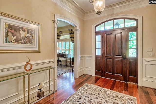 104 Preserve Ln, Columbia, SC 29209 - foyer with ornamental molding, wainscoting, dark wood-style flooring, a chandelier, and arched walkways